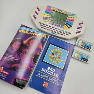 1995 Tiger Hand Held Electronic Wheel Of Fortune Expansion Cartridges Book & VHS